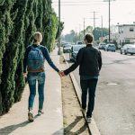 man and woman walking on pathway during daytime